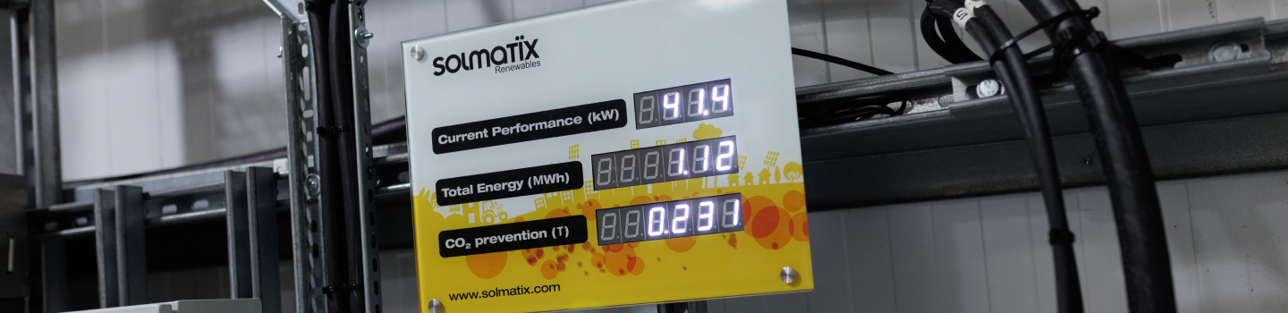 Solmatix branded digital solar display unit showing performance metrics.